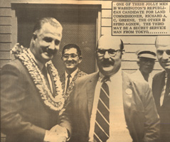 Spiro Agnew shakes the hand of Richard A C Greene